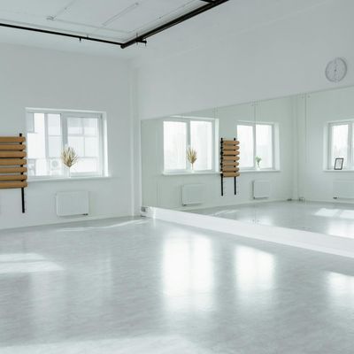 Minimalist room with natural light for practice.